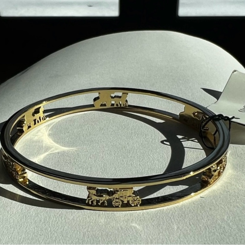 Coach Elegant Gold Bracelet with Carriage Design